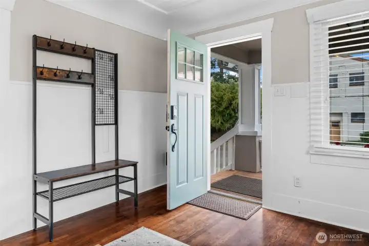 Welcoming Entry with Rich Hardwood Floors and Craftsman Charm