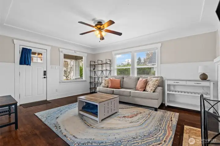 Bright & Inviting Living Room with Hardwood Floors and Classic Wainscoting