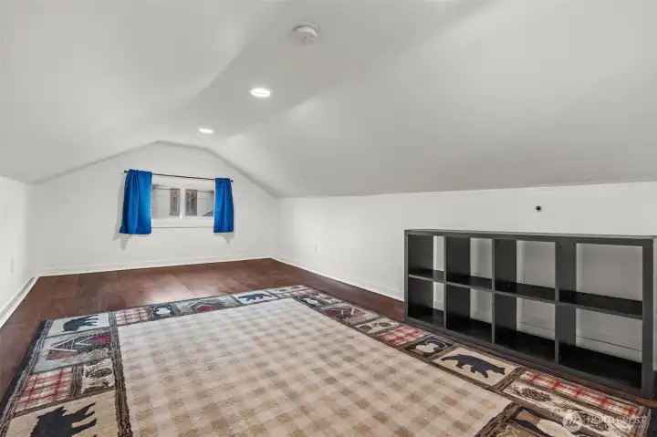 Spacious Bonus Room with Vaulted Ceilings and Hardwood Floors