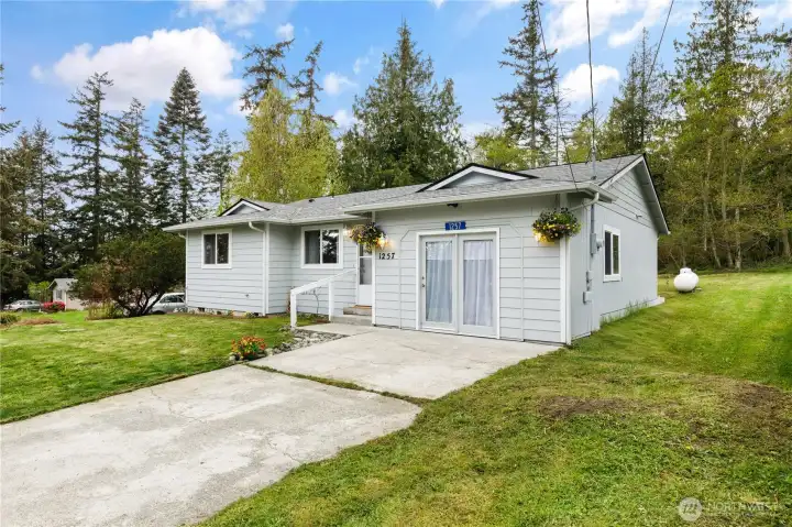 Welcome home to your peaceful retreat, surrounded by the beauty of the Olympic Mountains & just moments from the beach. This charming 2-bedrm rambler offers the perfect blend of comfort, style, & coastal living.Step inside & feel instantly at ease in the light-filled living spaces,where skylights brighten both full bathrms & the open layout creates a welcoming flow between the living & dining areas. The updated kitchen is ready for everyday living & entertaining alike, featuring modern appliances, a large gas stove, plenty of counter & cabinet space.The spacious primary bedrm is your private haven, complete w/a walk-in closet & its own full bathrm. A generously 2nd bedrm offers flexibility for guests, a home office, or whatever suits your lifestyle. With newer carpet & thoughtful updates throughout, this home is truly move-in ready. Outside,you’ll love the expansive backyard—perfect for relaxing,gardening, or hosting gatherings—w/a patio, raised garden beds, & even a greenhouse w/extra
