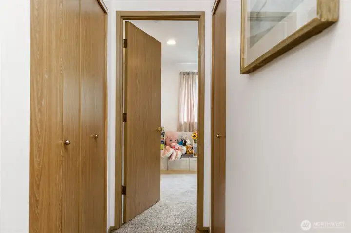 Call with a huge closet with shelves, and a coat closet across.