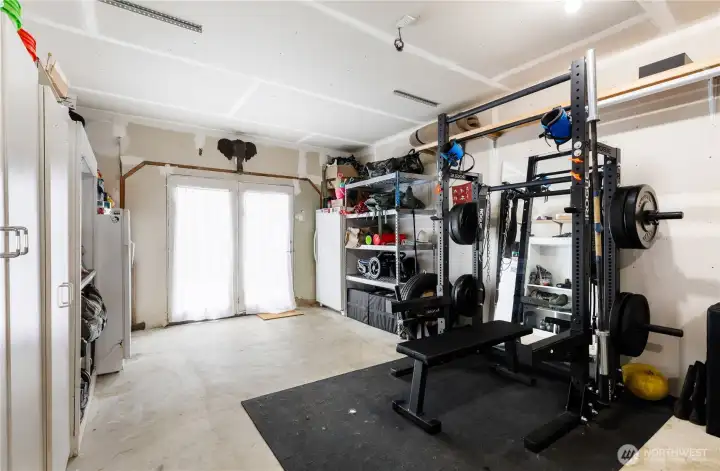 Flex room! This room has a wall cadet heater to keep you warm.  It has lots of storage cabinets. French doors to the driveway. It is being used as work out room. Washer and dryer hookups. This room has so many possibilities you can turn it into anything you want!