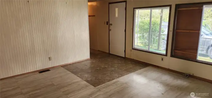 Entry into the living room with big picture windows.