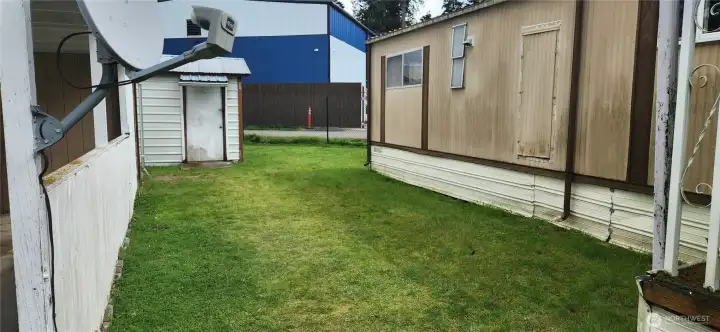 Nice side yard between the home and the carport and sheds