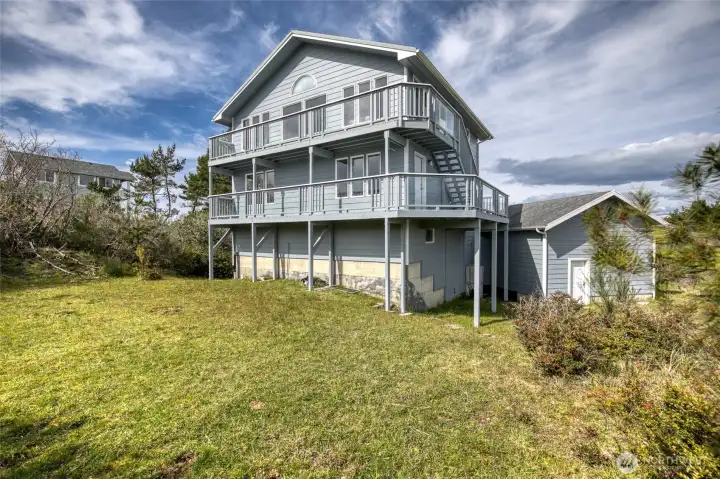 Expansive decks and large back yard back to the wildlife preserve and overlook the bay.