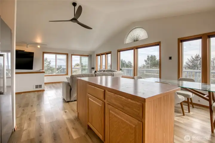 Vaulted ceiling and ceiling fan add ambiance to the living area.