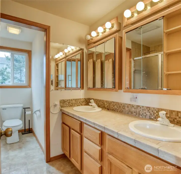 Main bath on second floor is a three-quarter bath with dual vanity.
