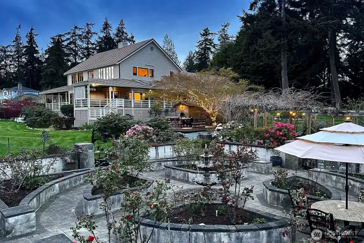 Enjoy a beverage sitting in the Chateau rose garden.