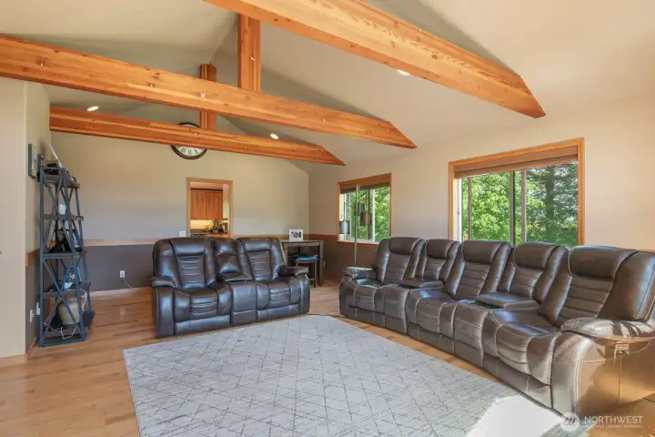 This photo shows the expansiveness of the living room and the wood beams! Calm colors add to the elegance. This photo shows the expansiveness of the living room and the wood beams! Calm colors add to the elegance.