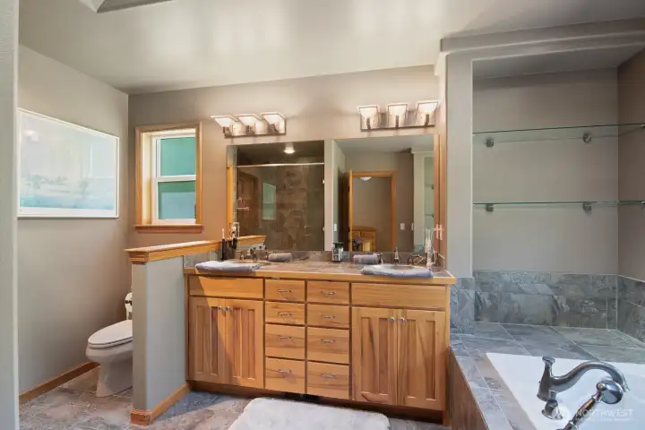 Primary bath with tile and dual vanity, & jetted tub. Primary bath with tile and dual vanity, & jetted tub.