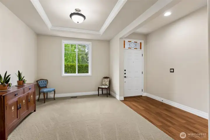 A nice sized dining room with coffered ceilings and bright front facing window. The transom over the  entry door adds a bit of extra charm and character to this home.