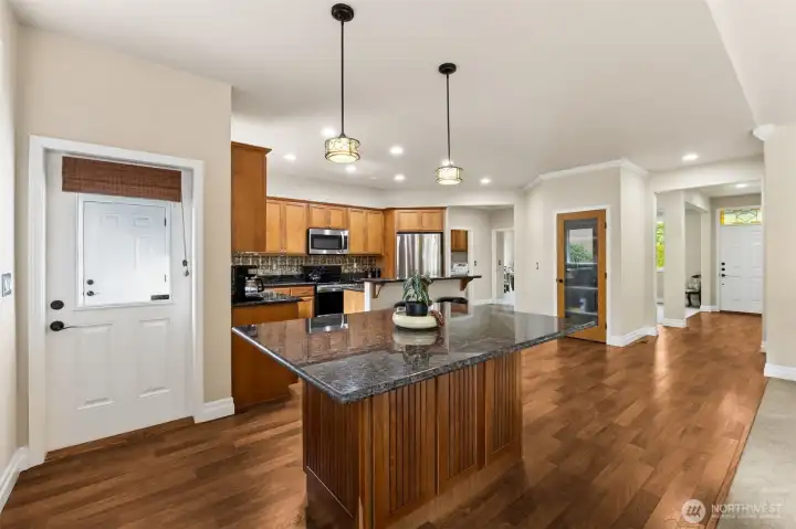 Open and bright kitchen with multiple eating areas allows plenty of room for large gatherings.