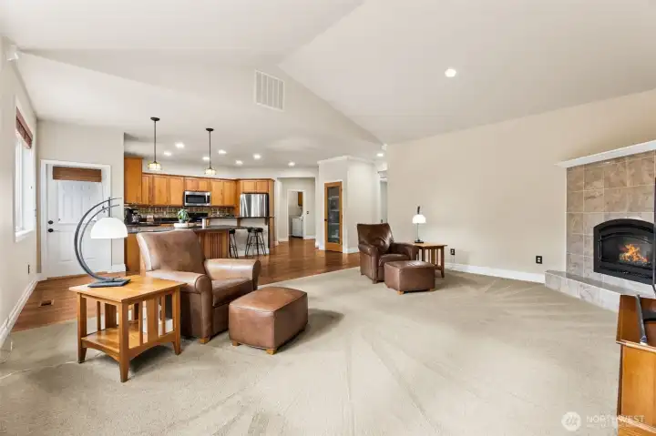 From the kitchen area you can be certain not  to miss anything- the family room boast  vaulted ceilings, corner gas fireplace & large  picture windows.