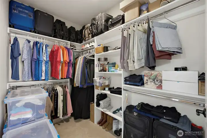 Closet organizers make this closet look easy  to help you stay neat and put together.