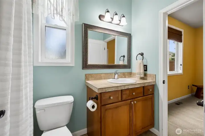 Full sized bathroom is shared between bedroom #2 and #3.
