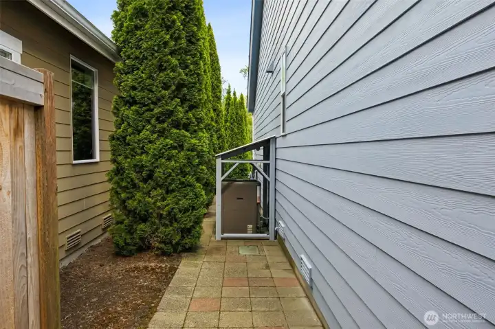 Nicely tucked away on the side of the home, the heat pump is covered and out of sight.