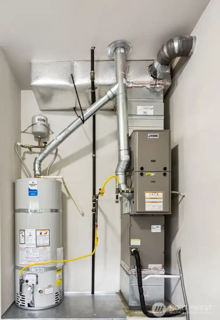 Two year old hot water tank + very well maintained gas furnace with air conditioning.