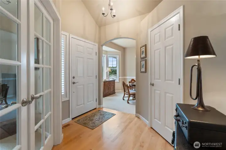 Hardwood floors in the entry, French Doors on the left lead to the de/office & arched opening to the dining room.  Entry closet to right.  Immaculate condition in the home.