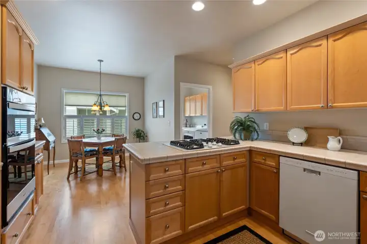 Spacious kitchen with full appliance package that stays with home.  Room for two cooks in this layout.  Wall oven to left is newer.