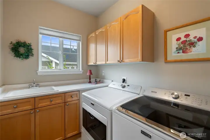 Laundry room with laundry sink & storage.