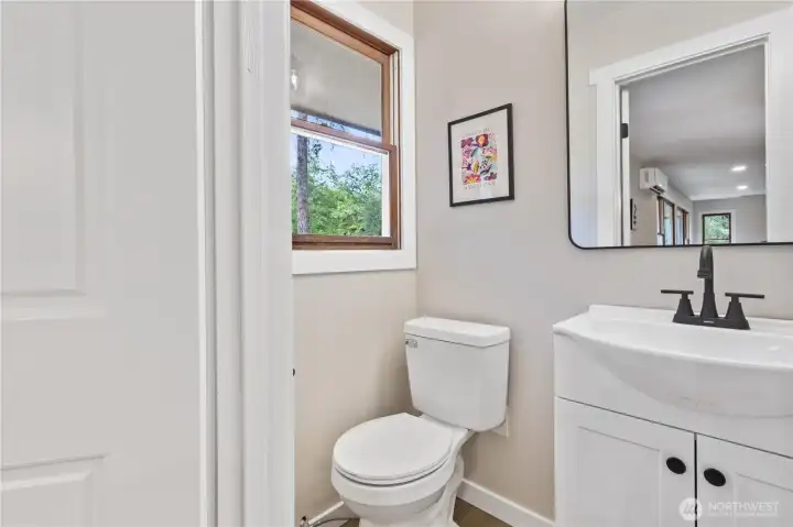 Guest 3/4 bathroom off of the dining room offers added flexibility.