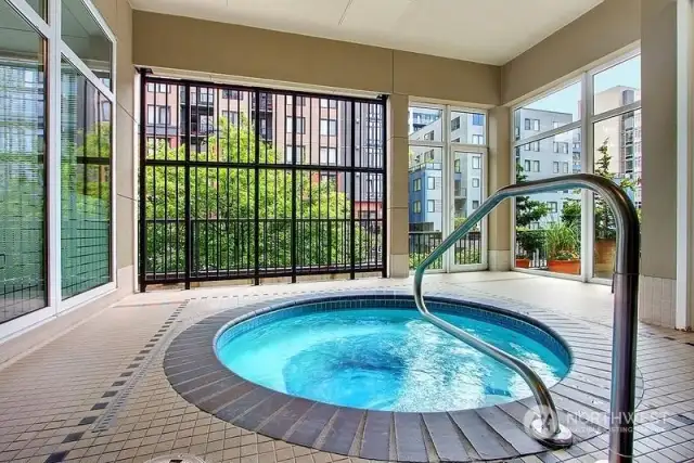 Hot tub adjacent to gym and patio
