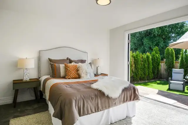 This lovely primary bedroom has French doors that open up to your backyard oasis making this your own personal retreat space.