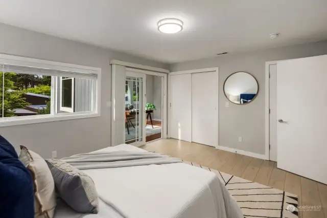 The bedroom also boasts luxury laminate floors that match throughout the house, plenty of closet space, and an elegant ceiling light that matches the ones in the other bedrooms.