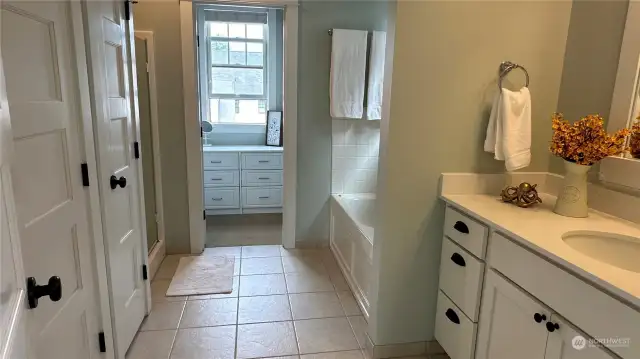 Primary bath features tile floor and a separate tub and shower. Large walk in closet with built ins. New countertops and undermount sink and new faucets just installed!!!