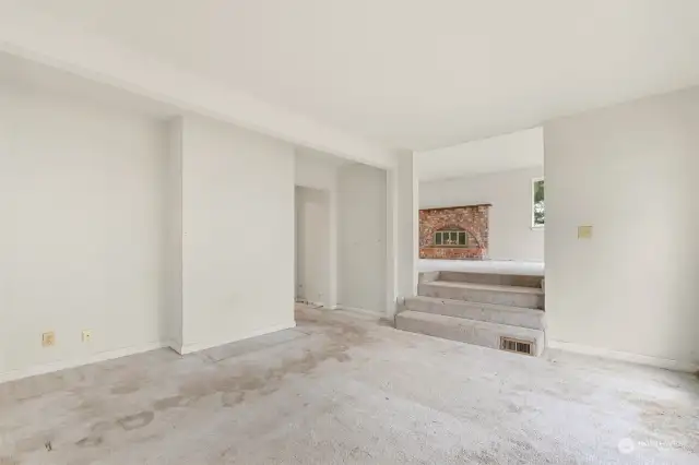 Dining area steps to living room.