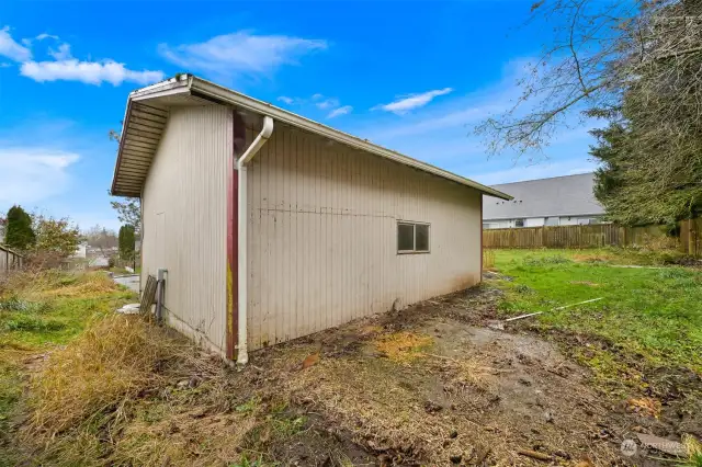 Lots of extra space behind back of detached garage.