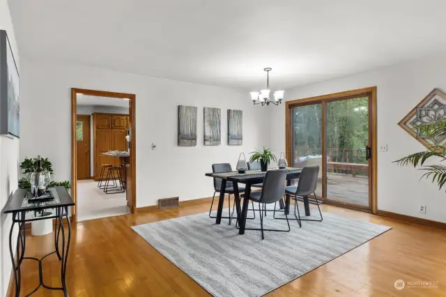 Formal dining with wood wrapped sliding door to deck space