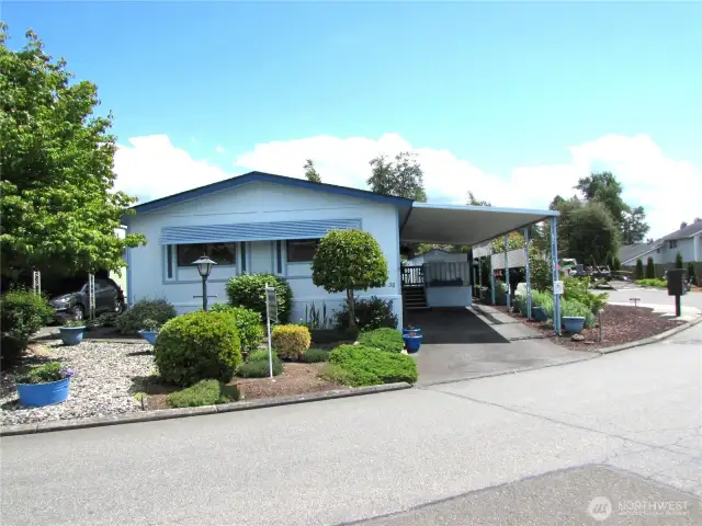 1,056 Sq Ft, 2 Bedroom /2 Bath with covered parking, covered deck and raised garden beds. Dog park and other open space surround the home.