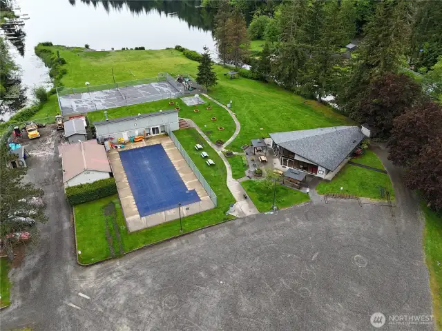 Community center with pool, clubhouse, sport court, playground and lake access.