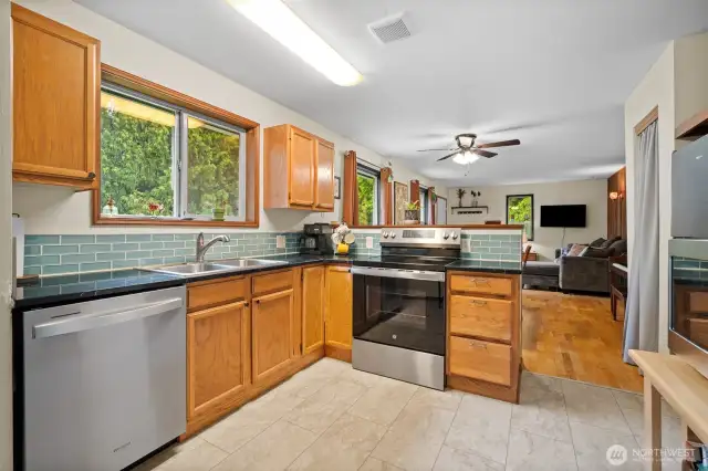 updated kitchen with granite counters and brand new stainless appliances.