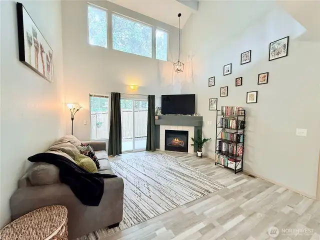 Great room with cozy fireplace and vaulted ceilings.