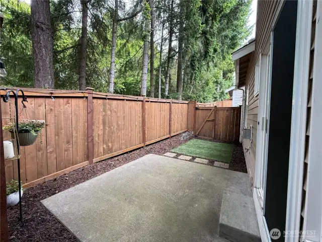Private, low maintenance, fully fenced yard with patio