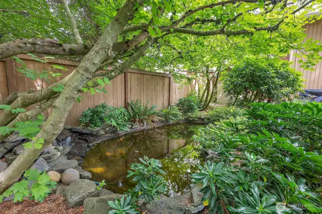 The pond has a cascading water feature that can be seen and heard from the decks, family room and primary bedroom.