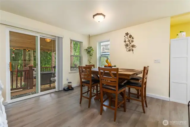 Dining area. Sliding door leads to the covered back deck and walking trails.
