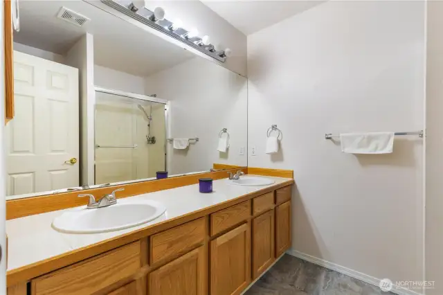 Primary bedroom with dual sinks.