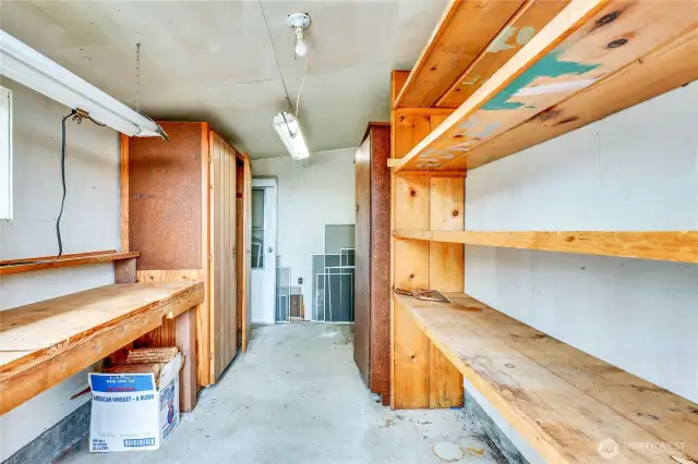 Storage shelves in the small space to the side of the garage.