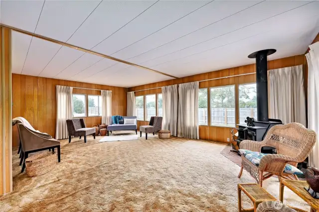 Large living room with lots of windows for great lighting.