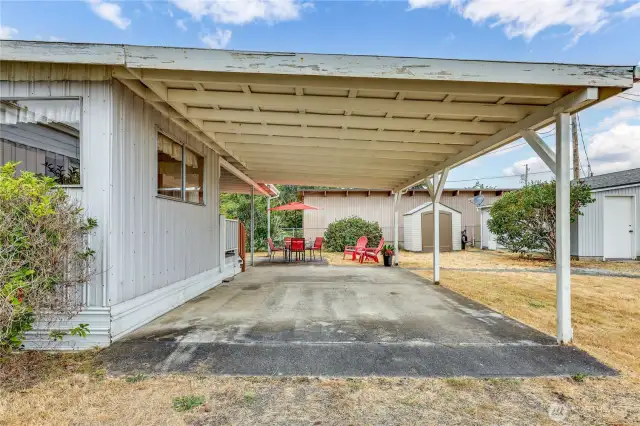 Covered carport, entry and part way over the patio.