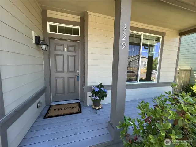 Covered entry deck and another place ready for outdoor seating to relax.