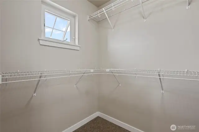 Main larger closet in Primary Bedroom,   (one of 2, the other smaller).