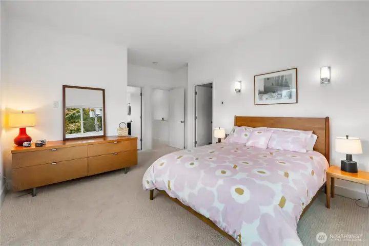 Main bedroom with private door to bathroom and walk-in closet.