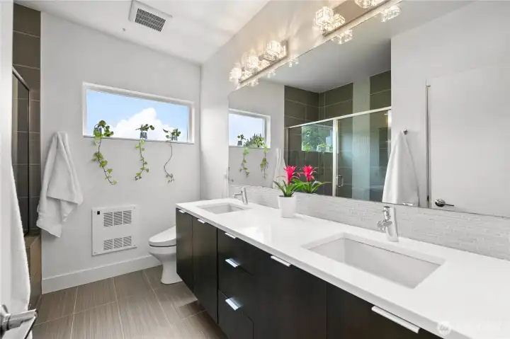 Upper bathroom with double vanity and huge shower.