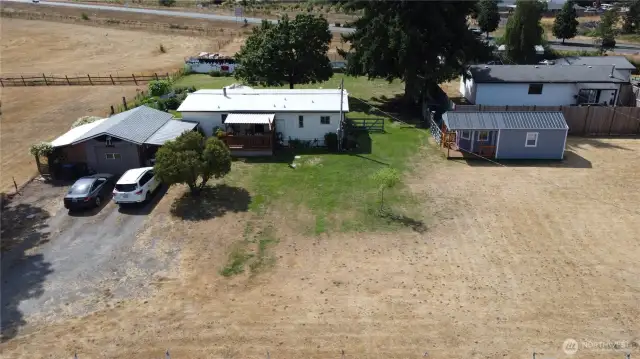 House, detached garage and a tiny house.