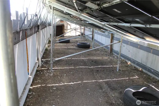 Chicken coop under the solar structure.