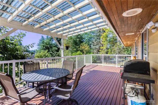 A partially covered section of the deck ensures year-round usability, rain or shine. With enough room for a dining table and seating, it’s perfect for morning coffee, evening dinners, or simply enjoying the fresh PNW air. The elevated view gives you a perspective of the backyard, blending comfort and convenience with outdoor living.